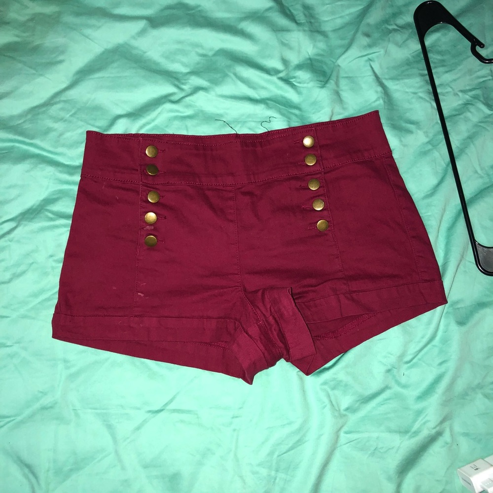Burgundy high waisted shorts.